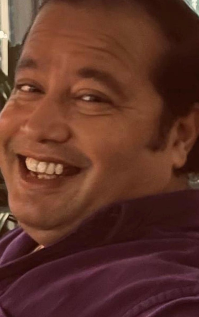 Man laughing in profile