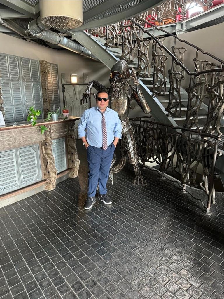 Patnaik posing in Alwernia Planet interior — alien sculpture